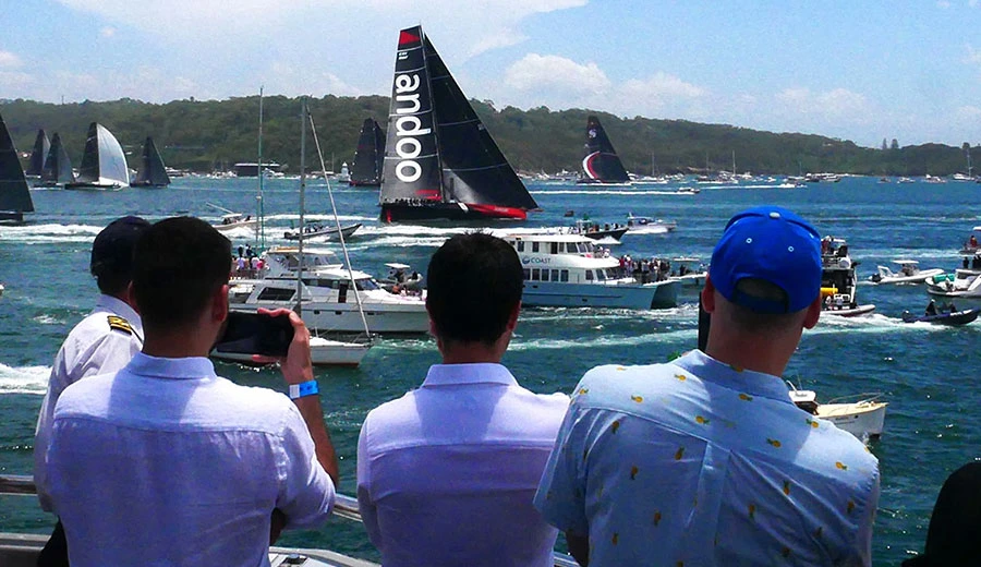 Sunbathing on a boat during Boxing Day hire on Sydney Harbour