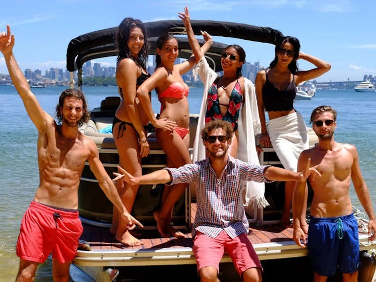 Boat party on sydney harbour with opera house in background